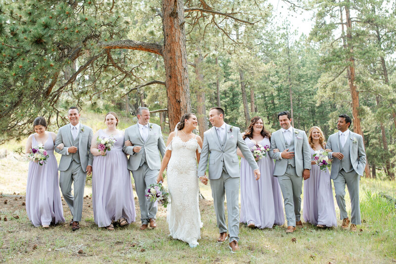 Bart and Kelsey with their whole wedding party in front of the tipi at Younger Ranch wedding venue.