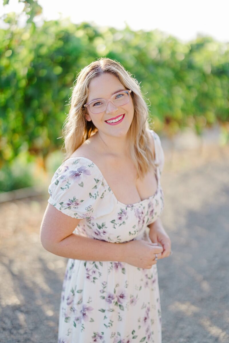 Napa  wedding photographer, Kristen Campbell, laughing towards the camera