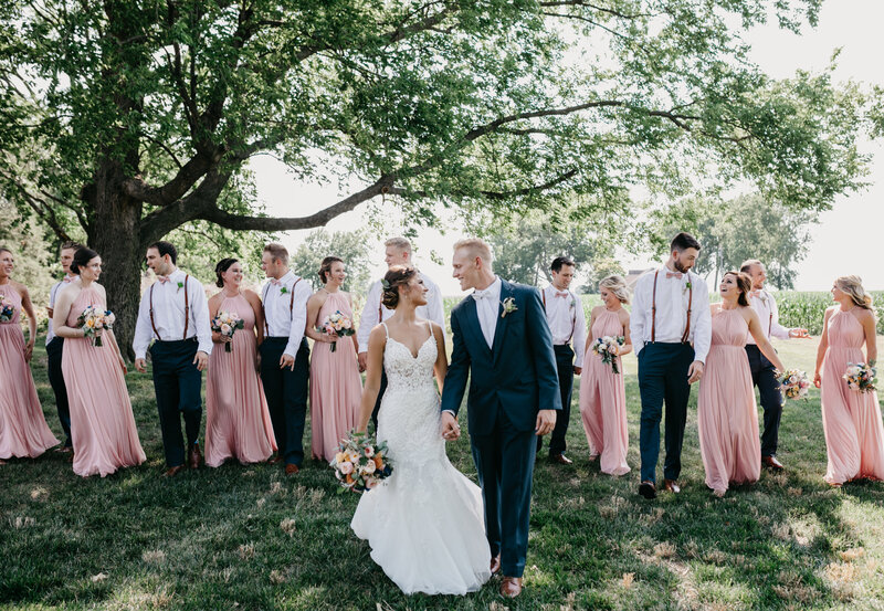 photo of a wedding party, pink bridesmaid dresses in nature Oregon Coast Elopement and Wedding Photographer