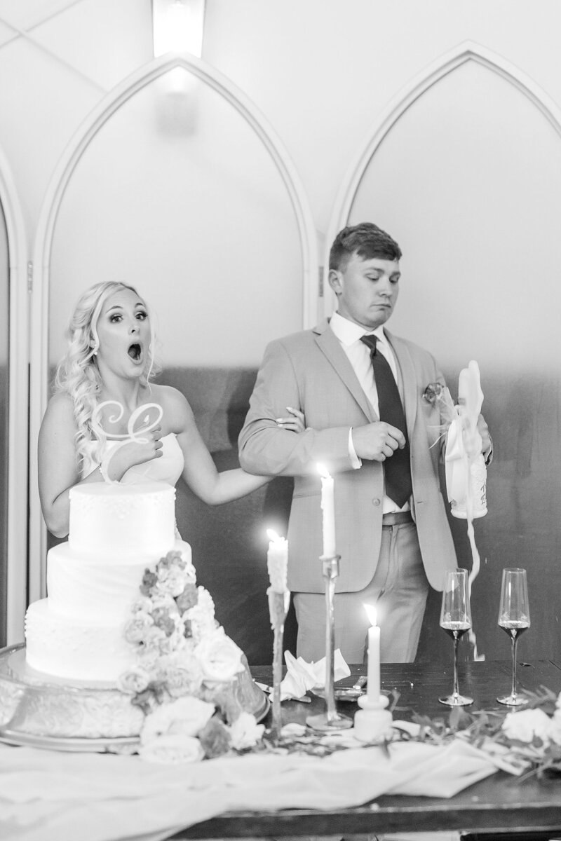 Bride and Groom popping champagne | New Water Farms Wedding Photography