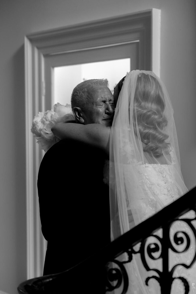 Bride giving father a hug before ceremony at Came House