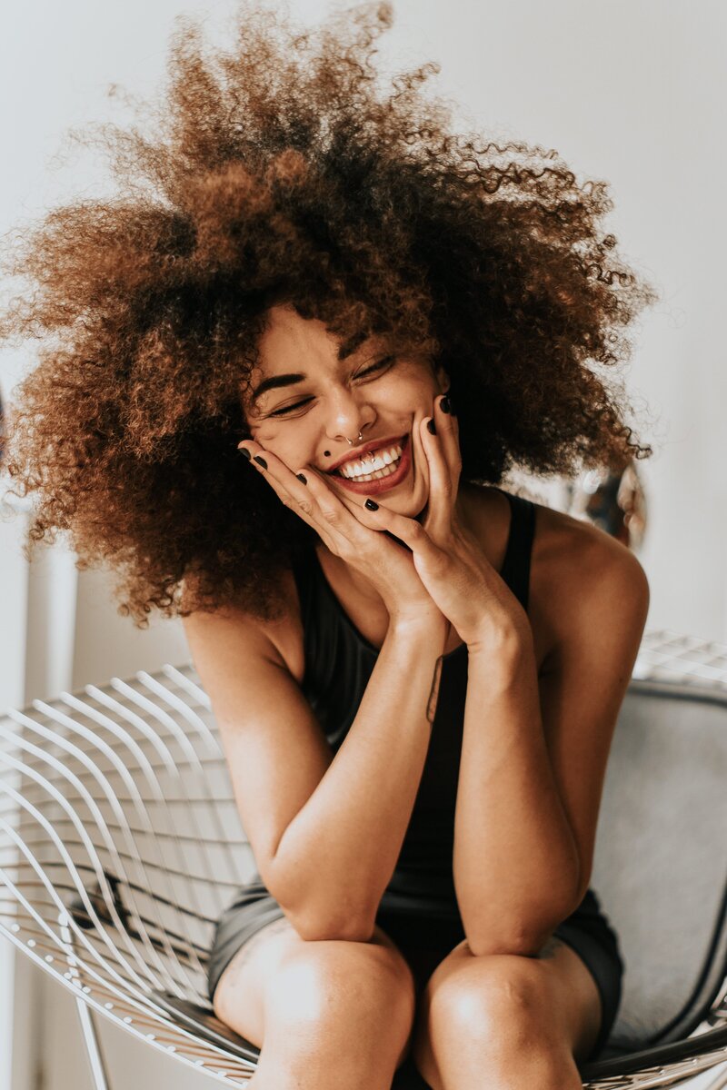 african american women pising on a chair