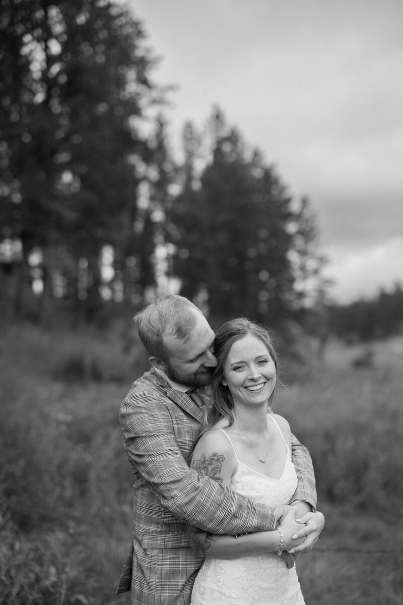 Couple laughing and embracing near Custer SD