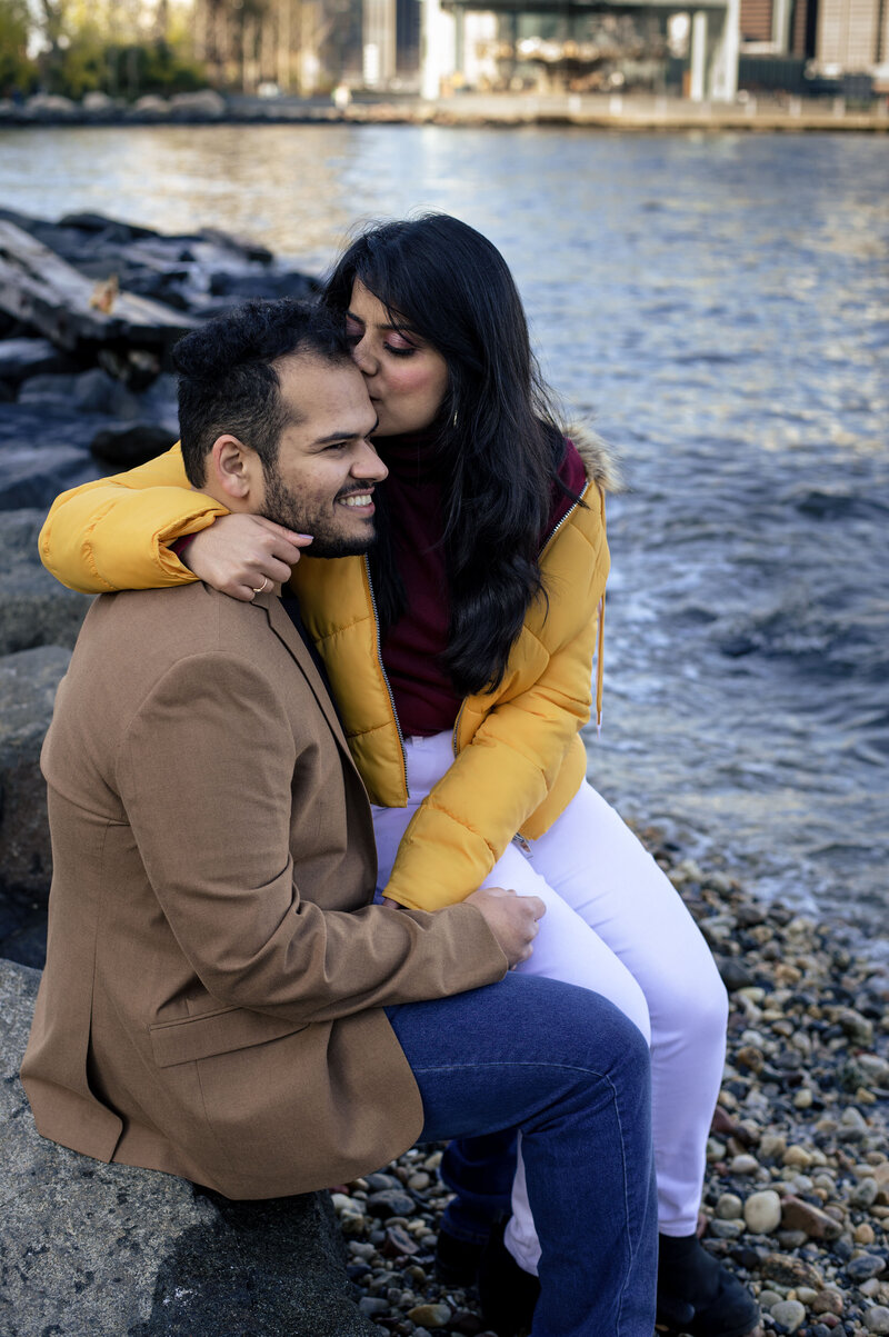 Young-Indian-couple-muzzling-in-pebble-beach
