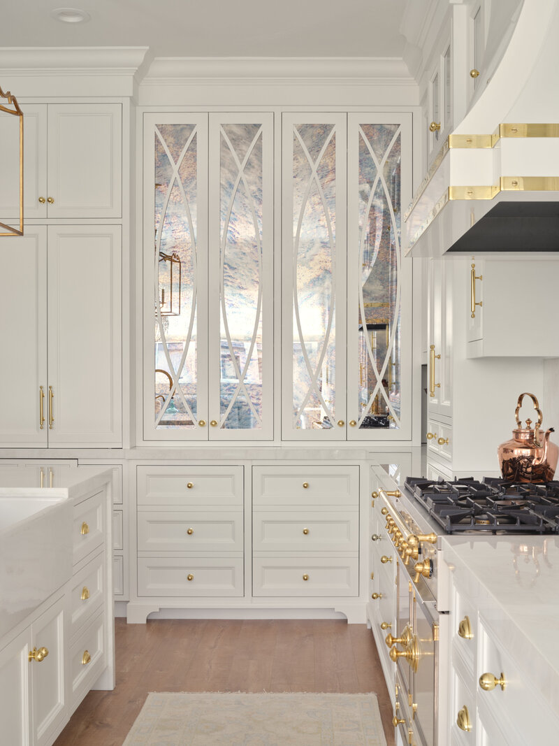 white luxury kitchen with gold accents and CornuFé  stove,