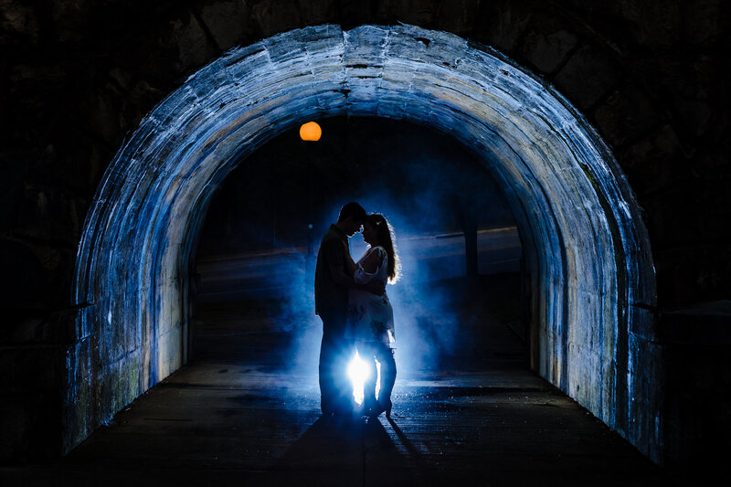 dramatic blue lighting of engagement session for couple