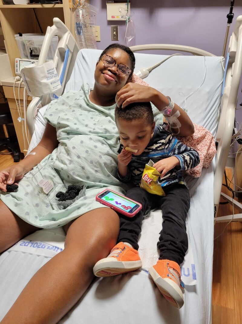 Black career coach for working women in labor and delivery with son