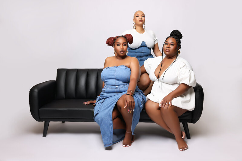 Meet the Ariel Enid Photography team, showcasing effortless style in white and denim. Glam by Pretty Faces by Chelsea and stunning braids by Jay the Braid Bully highlight their vibrant energy and beauty. Capturing the essence of Black excellence together!