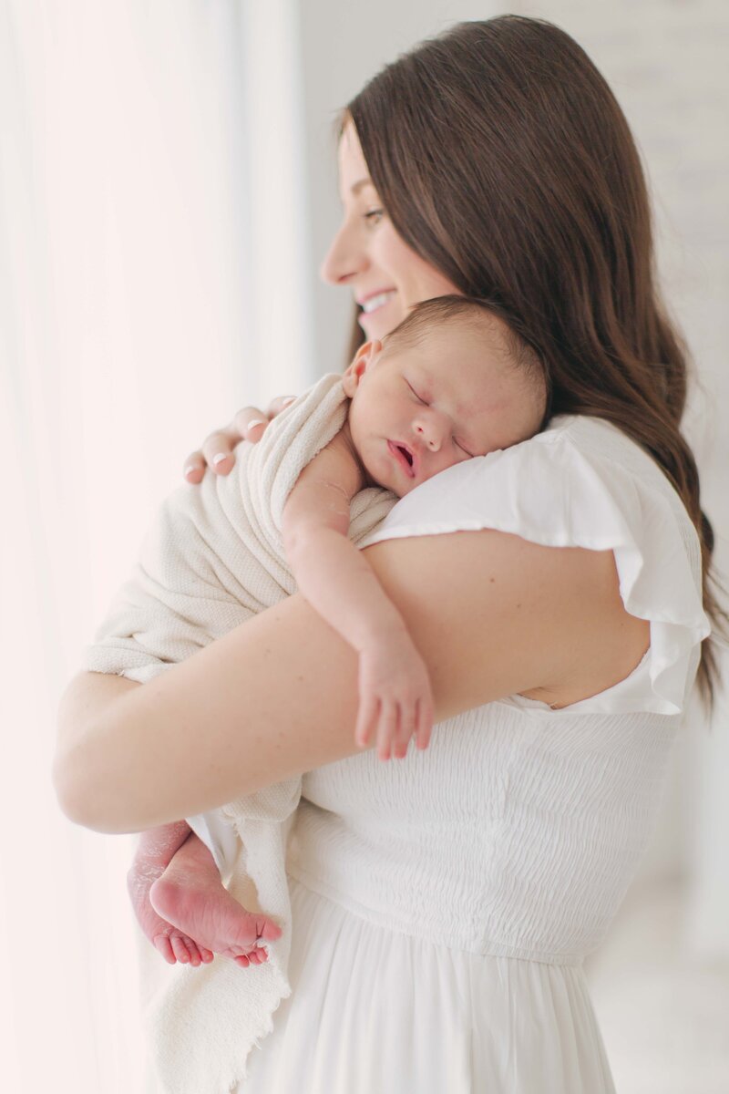 mother holding her newborn baby