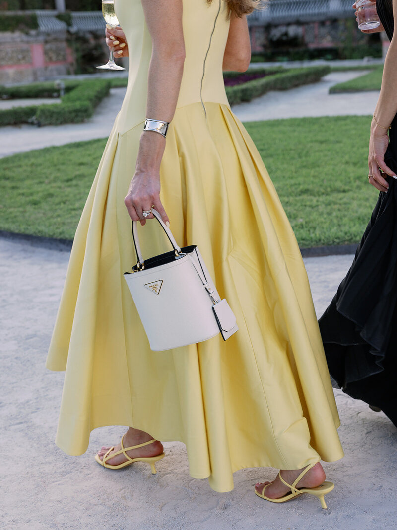 Bride in Vera Wang walks with bridesmaids at Blue Hill at Stone Barns wedding