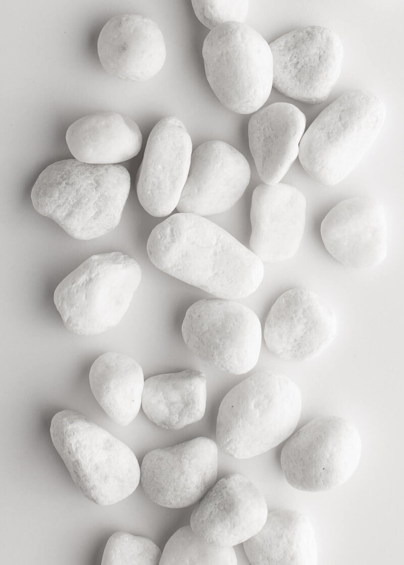 White Pebbles on a White Surface - Brenda Chadambura