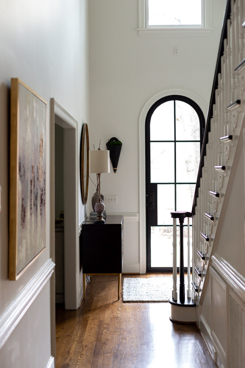 Open, high ceiling entry way designed by Zimmer Interiors in Charlotte, North Carolina.