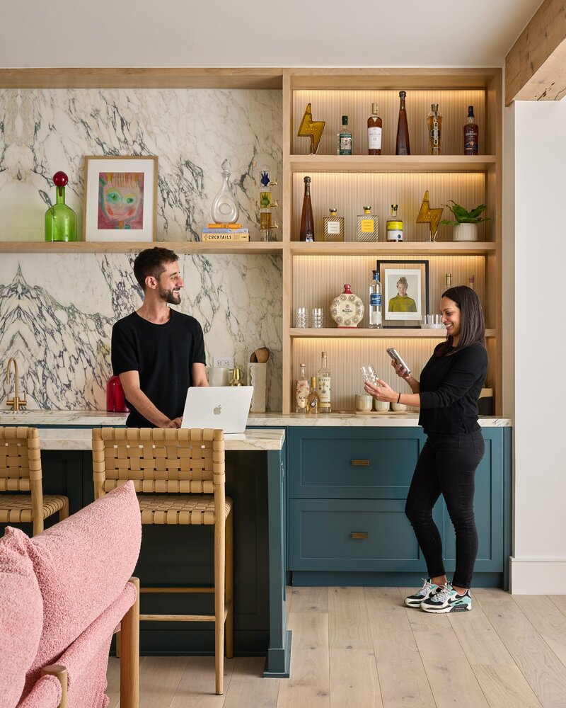 Certified organizers organizing a colorful kitchen
