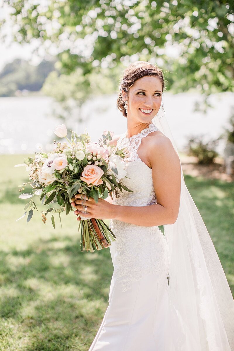 bride looking over shoulder by Knoxville Wedding Photographer, Amanda May Photos