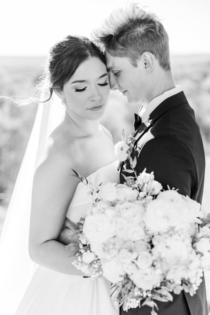 bride and groom embracing romantically