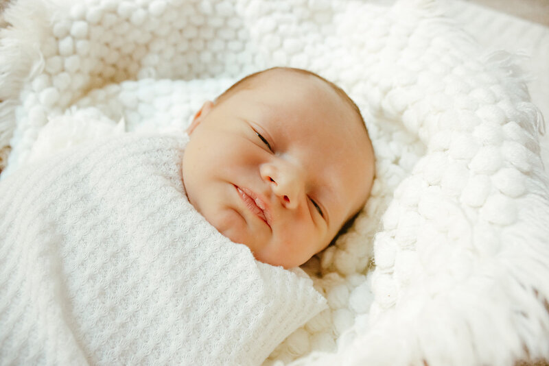 newborn with blanket