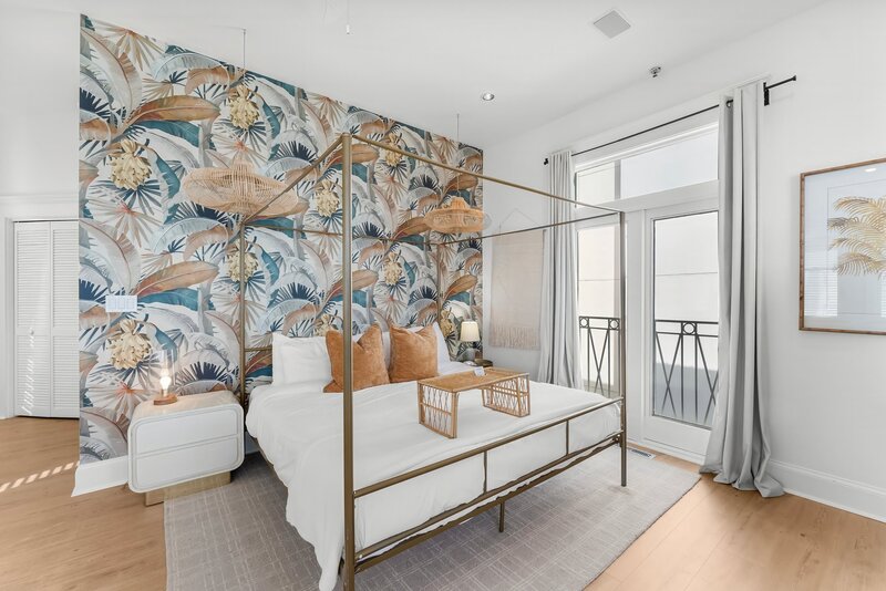 Tropical King Bedroom with Stylish Wallpaper Accent - Carillon Beach Condo