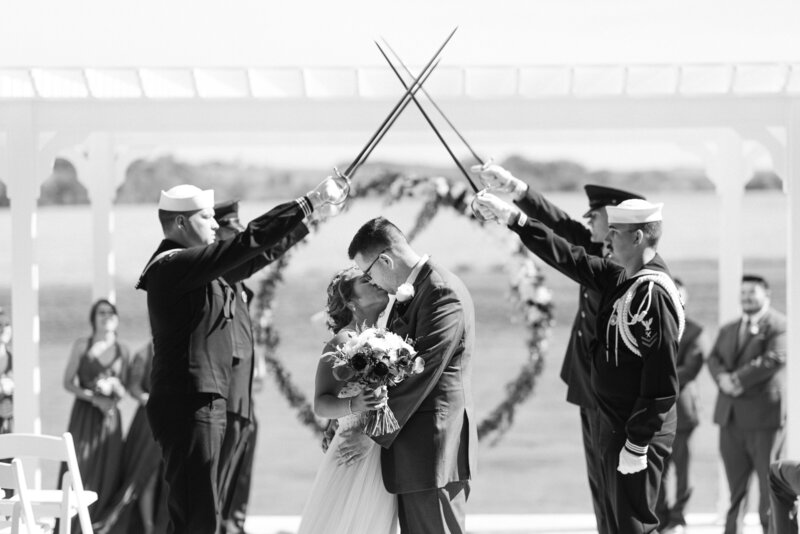 Bride and Groom kiss in a black and white photo at The Palace Event Center, an Omaha NE wedding Venue. Photo by Anna Brace, an omaha wedding photographer.