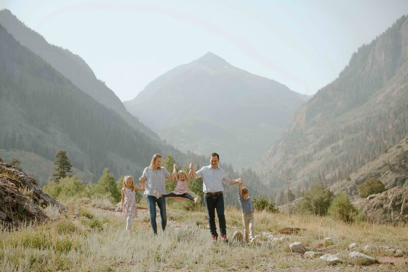 Family portrait in the mountains lifting up girl, Austin Family Photographer, Tiffany Chapman Photography