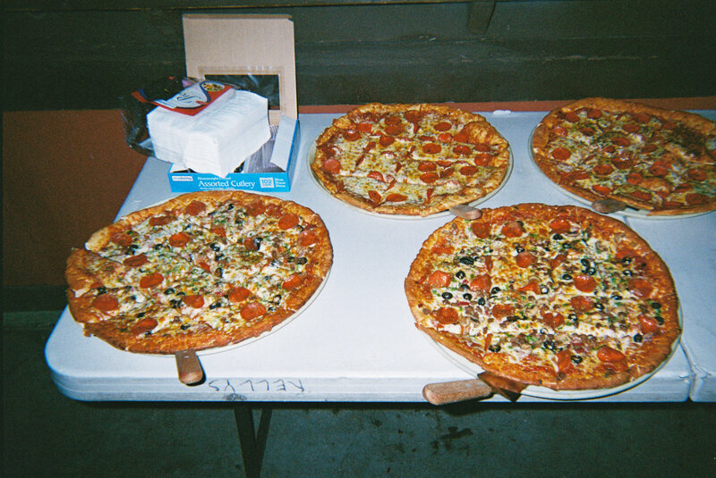 An indie LGBTQ+ couple’s moody editorial wedding portrait, photographed in a true-to-color style by Chelsea Stanford in Missouri