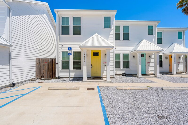 Charming coastal townhouse with vibrant Yellow Door at Beach Cabana, Panama City Beach vacation rental ideal for families, couples, and content creators.