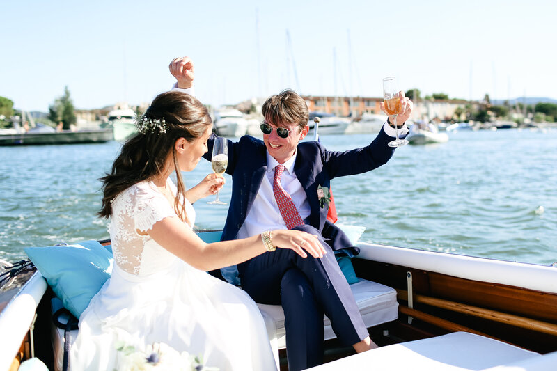 couple-celebrating-with-champagne-at-luxury-wedding-in-port-grimaud