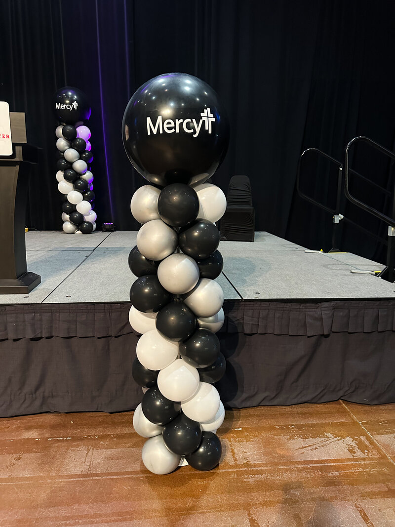 black white and silver balloons for corporate event
