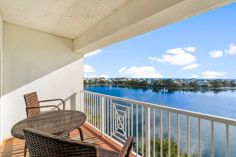 balcony with brrown wicker furniture