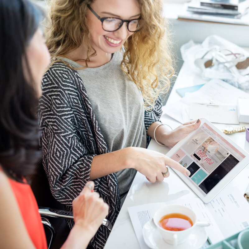 Woman happily shaking hands in her client for a successful business