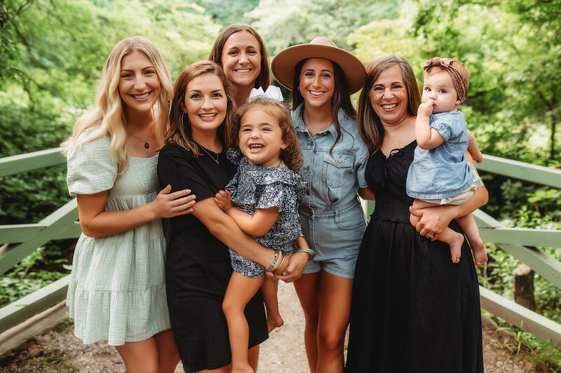 Family embraces in a Lavender Field during Family Photos in Asheville, NC.