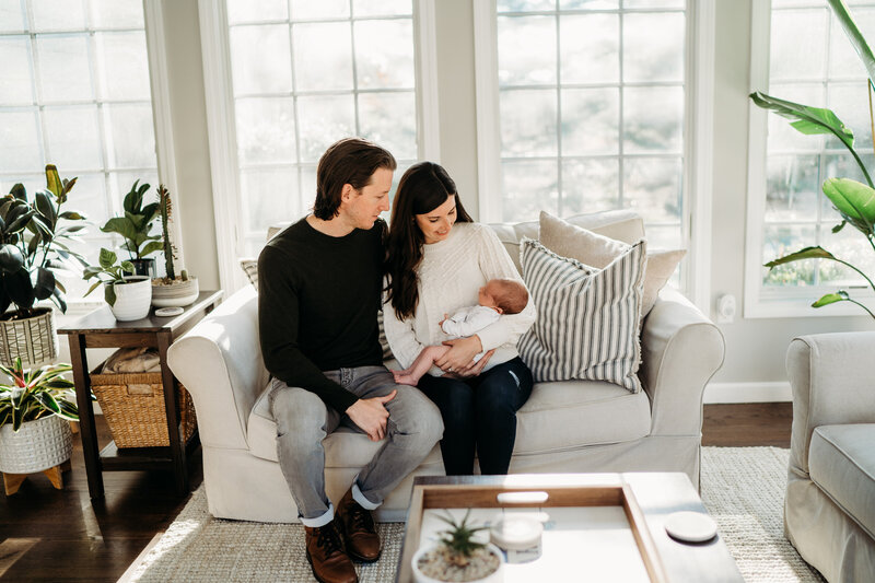 boston parents holding their newborn