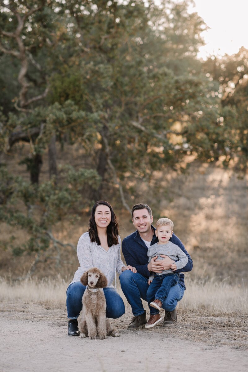 Family kneeling at Jim Green trail in Atascadero California