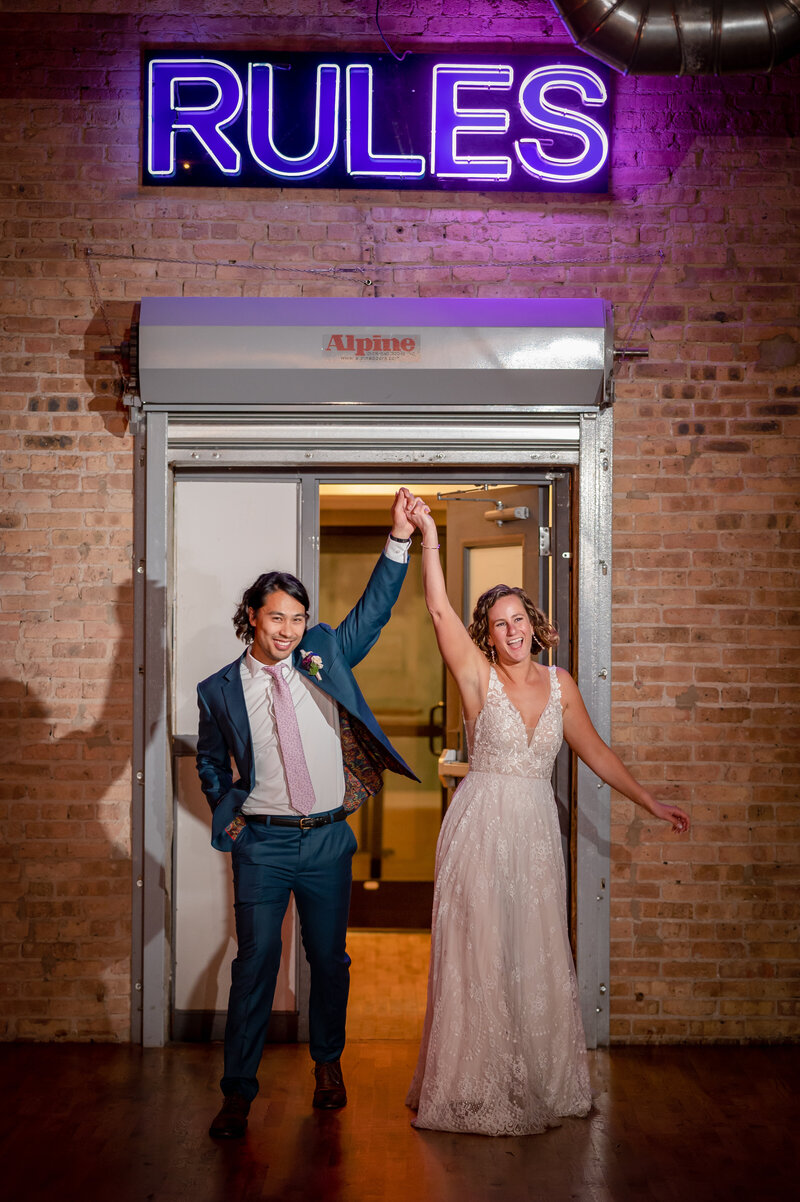 Bride and groom enter their rececption at Lacuna Loft in Chicago