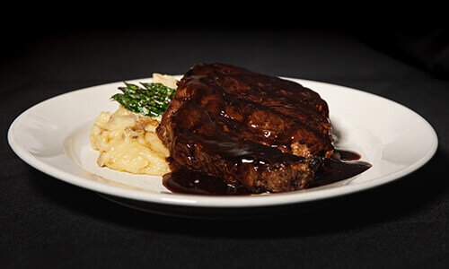 Boneless Ribeye with tarragon demi and garlic mashed potatoes