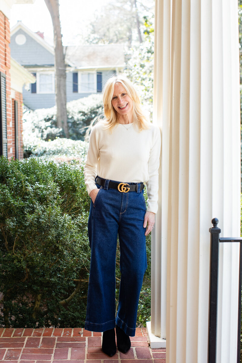 Atlanta Interior Designer Andi Morse of Morse Design stands outside of a new build project