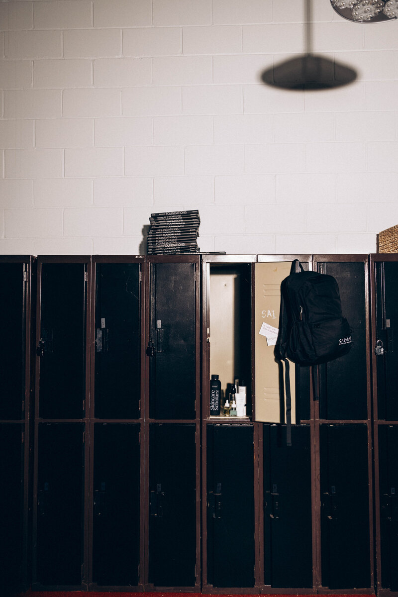 A neatly organized locker brimming with premium skincare products, each meticulously arranged to showcase the tools of the trade for future beauty professionals.