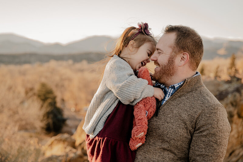 Dad cuddles daughter in Northern Colorado\