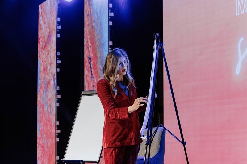 Macy McNeely taking notes at the Marketing Matters conference