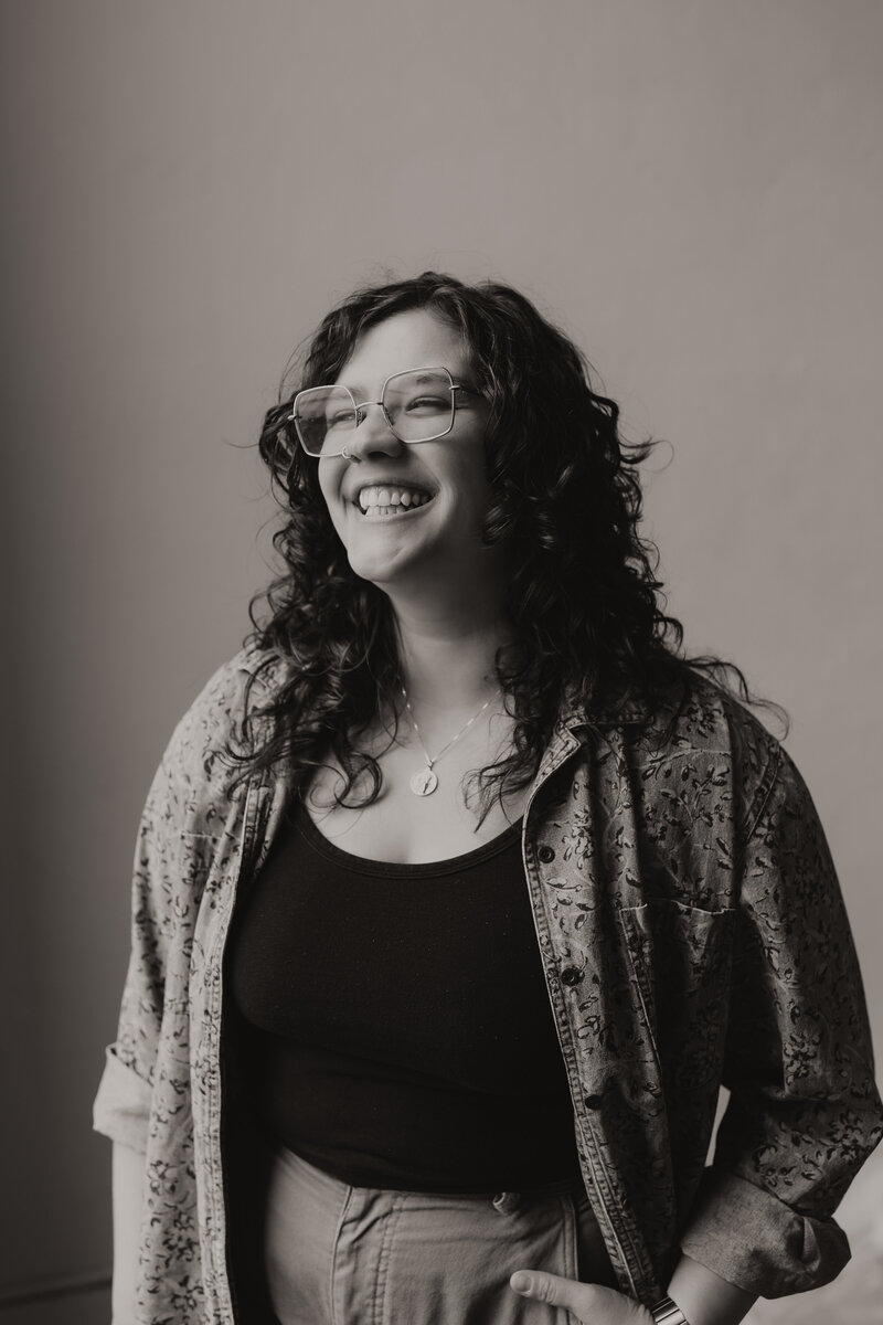 black and white photo of Loren Marshall, LPC, in Oklahoma, smiling and looking to the left  