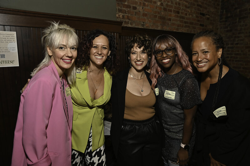 Group of young adults smiling at each other