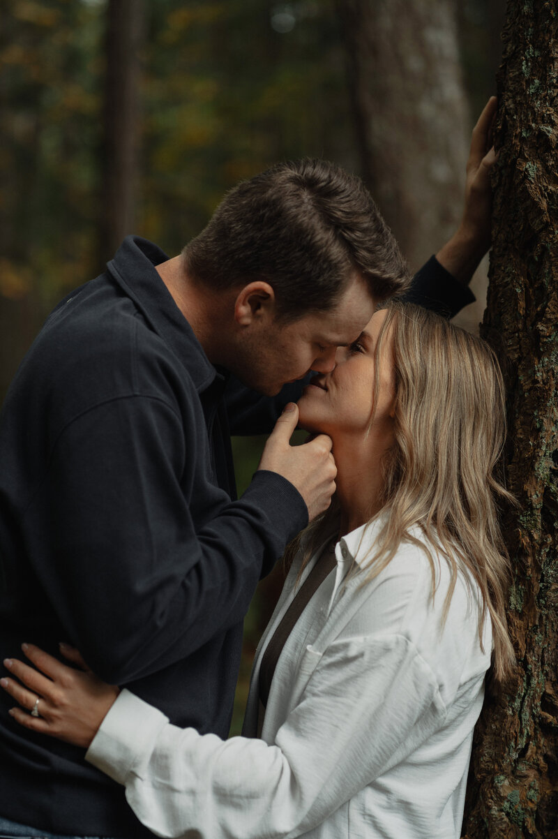 Engaged couple sharing a special moment in the forests of the Comox Valley 