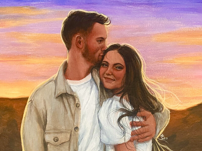 A portrait of a young couple smiling in front of a sunset.