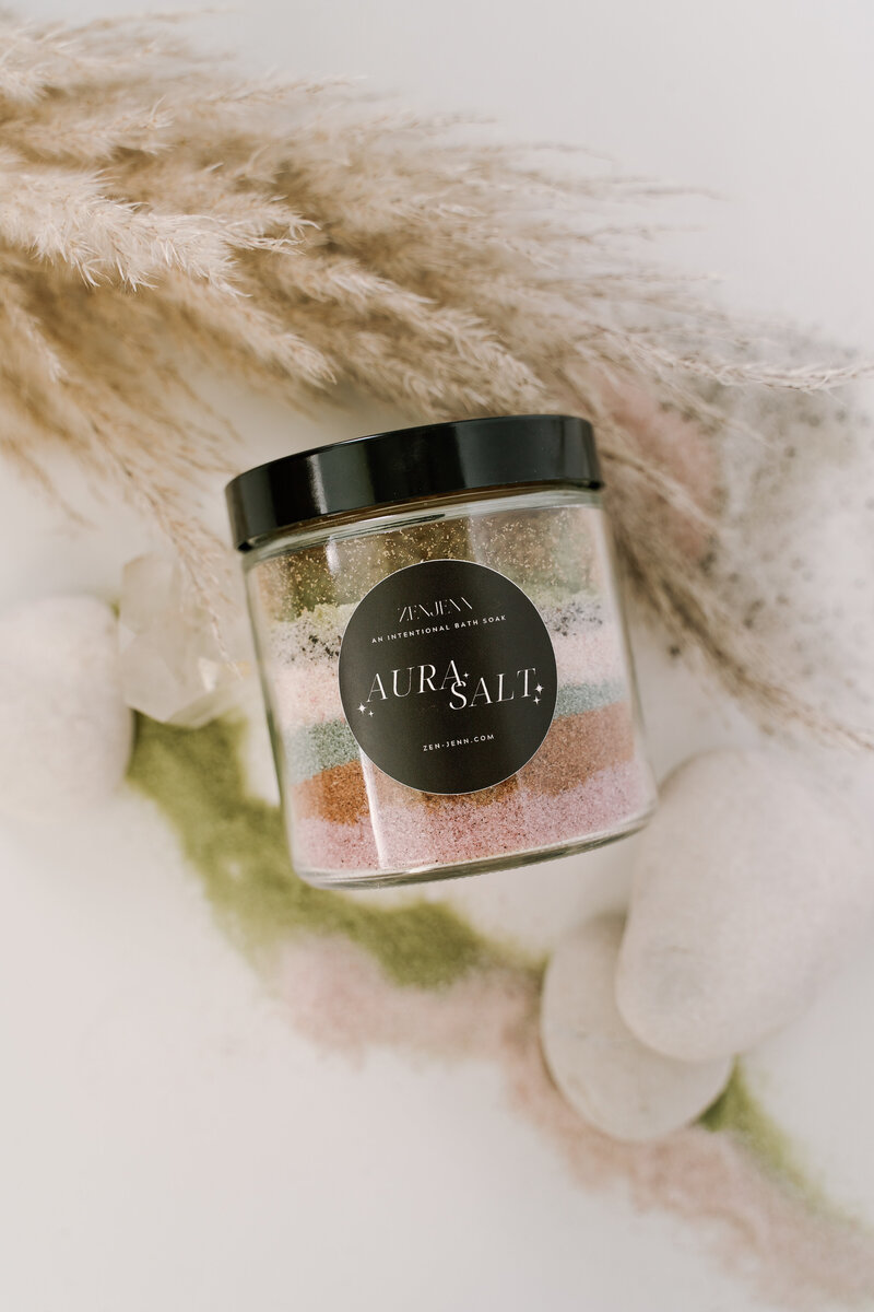 Flat lay brand photography of colored layered bath salts taken by Emma Leigh Studios.