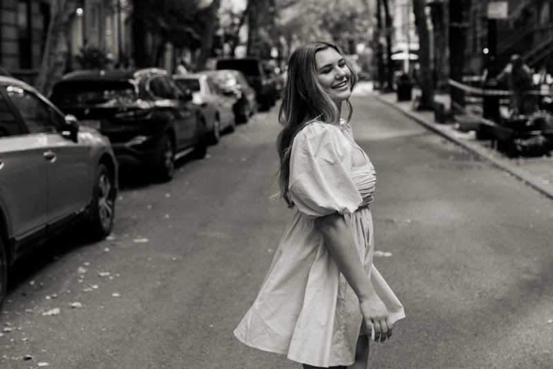 Greyscale picture of a girl in the street