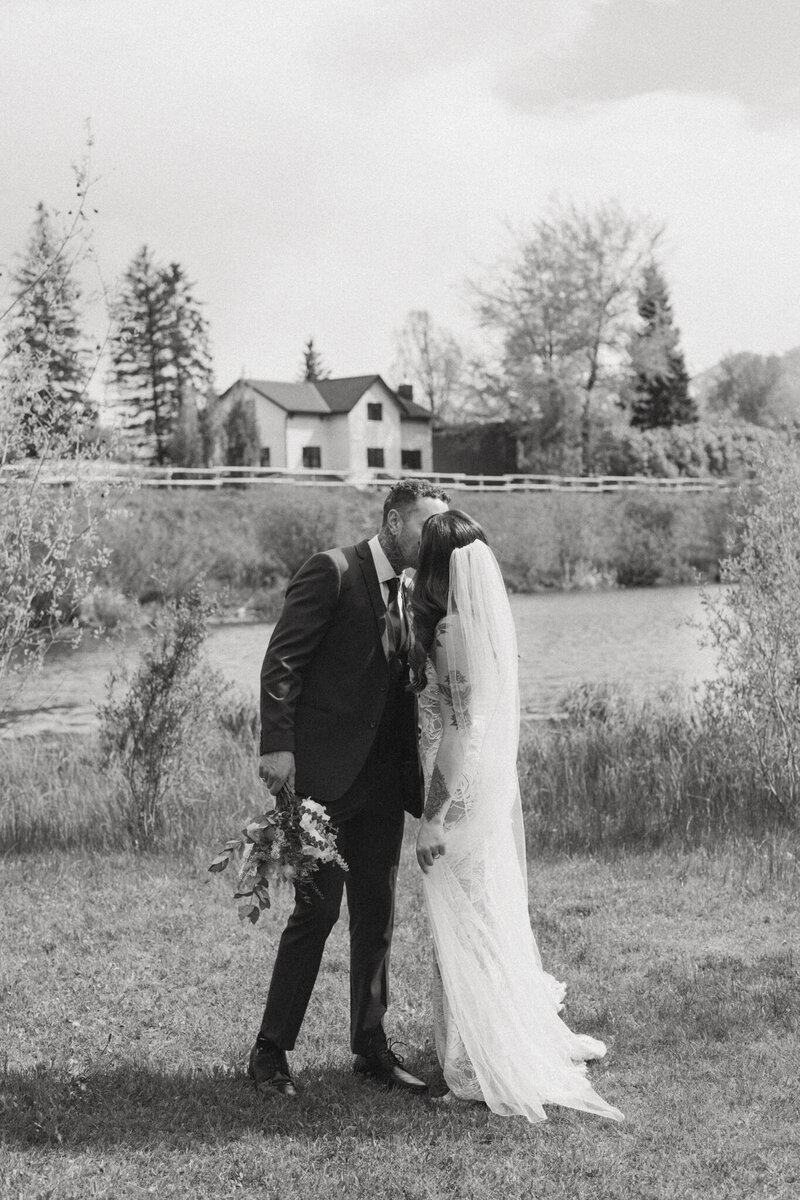 bride kissing at calgary alberta wedding