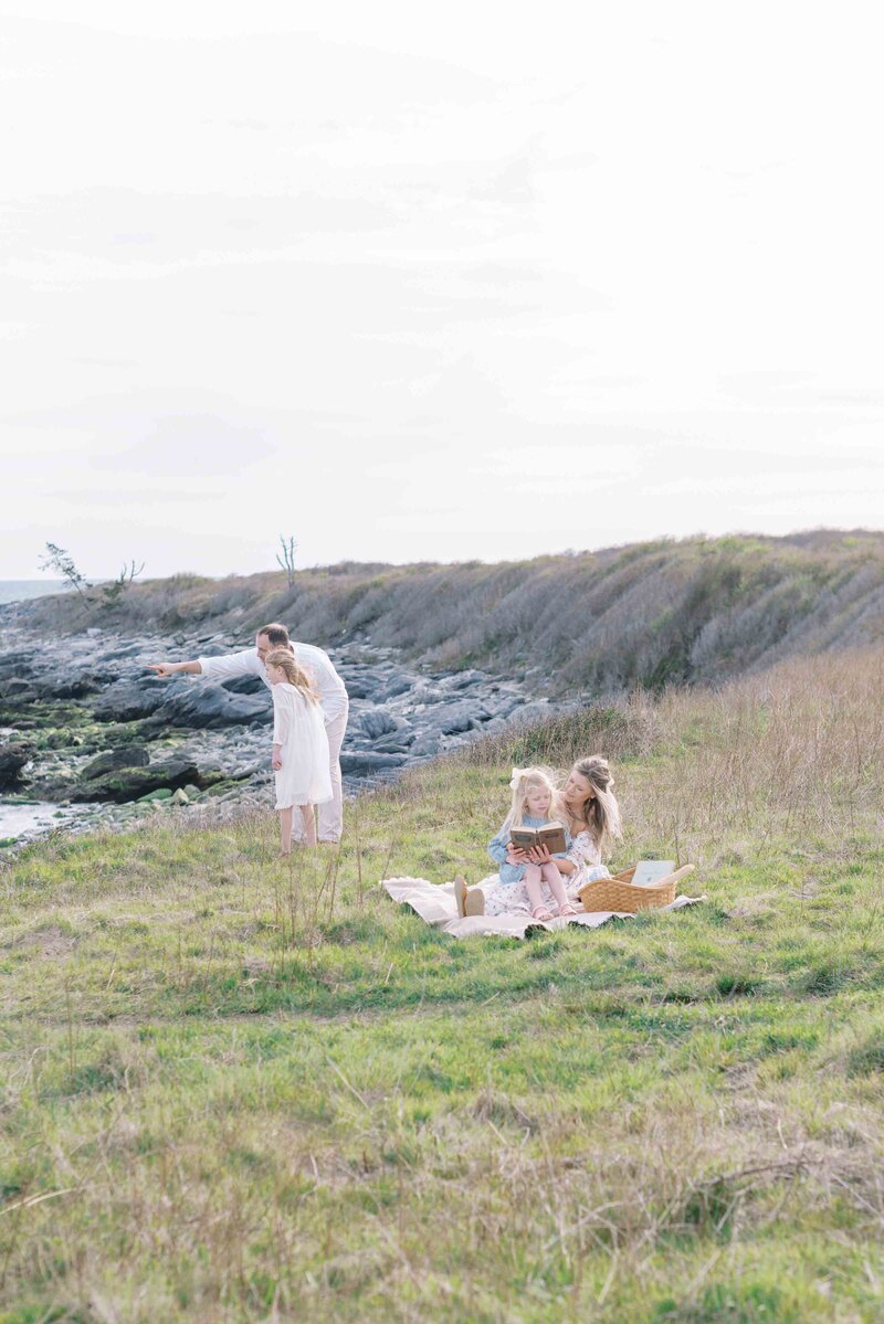 Richmond Family Photographer | A family in a green grass field in Richmond by light and airy film photographer, Jacqueline Aimee.