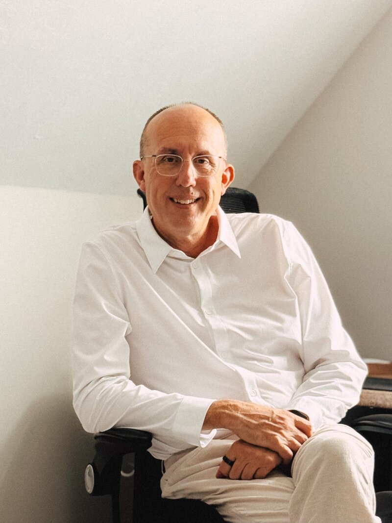 Erich Fogg seated and smiling, experienced PANCE and PANRE coach based in Maine