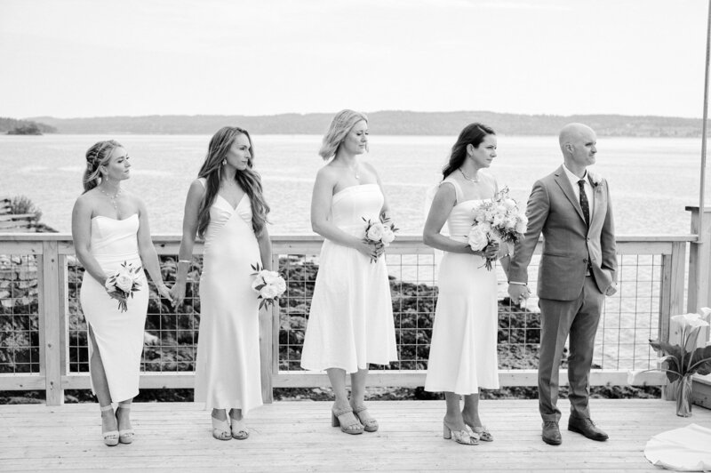 Emotional bridal party watches the wedding ceremony