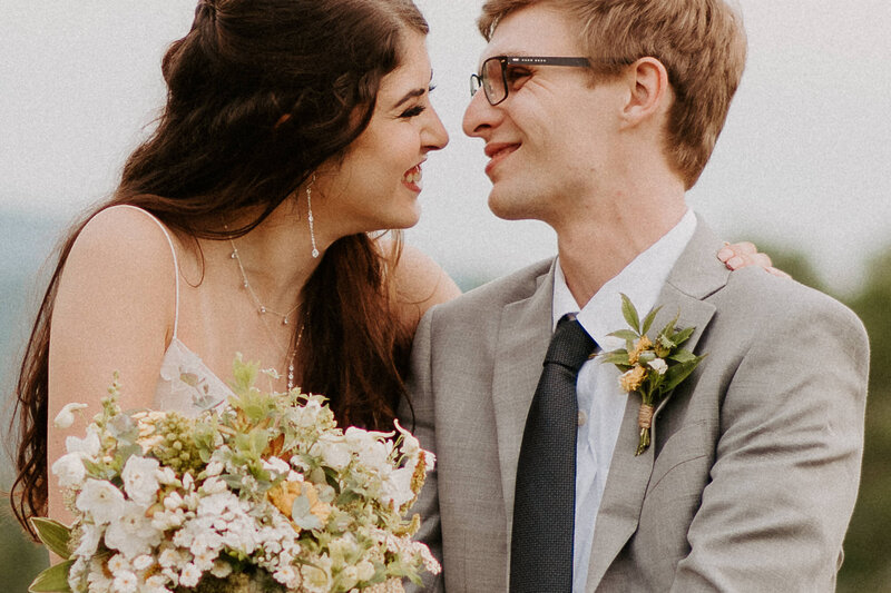 close up photo of bride and groom going in for a kiss during their summer brewery wedding in Roanoke, Virginia
