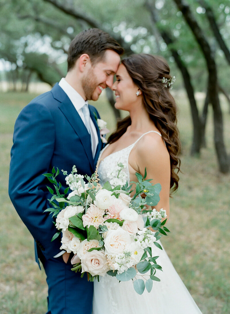 bride and groom with white flowers